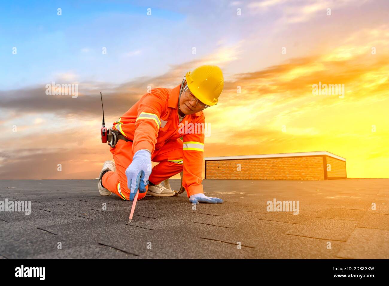 Engineer working on a roof, Thailand Stock Photo