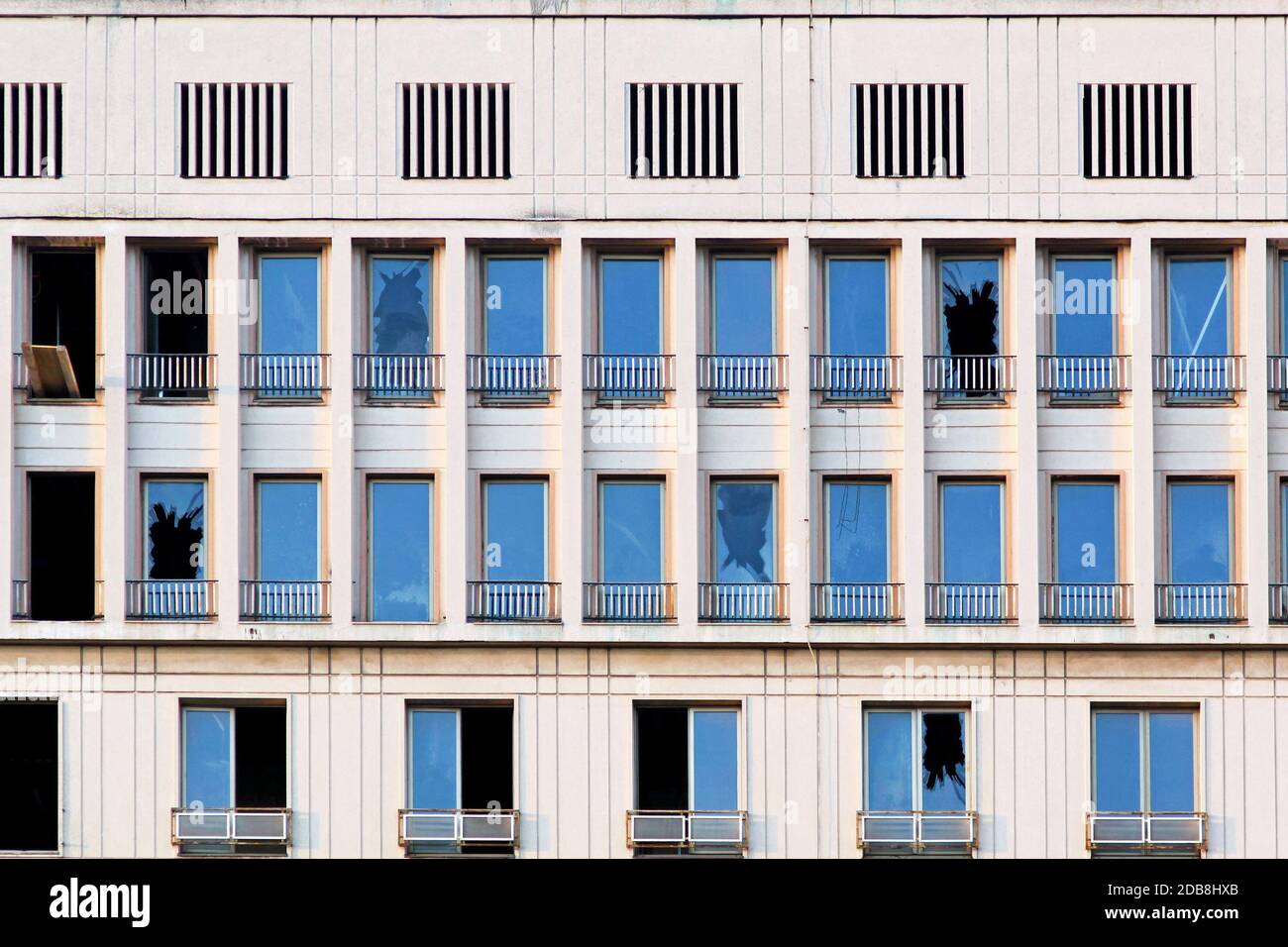 Broken windows at building after earthquake destruction Stock Photo Alamy