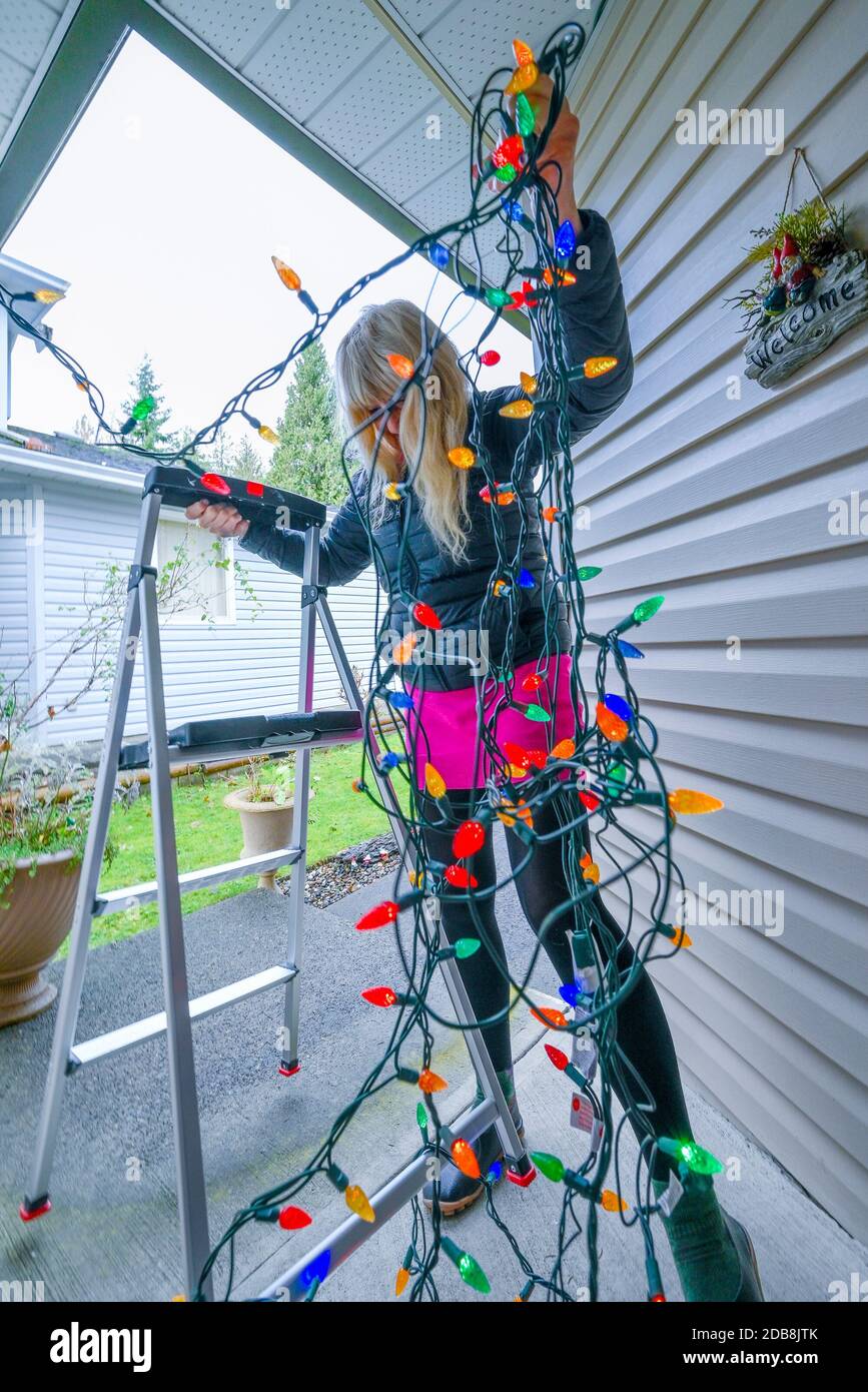 Putting up christmas lights hi-res stock photography and images - Alamy