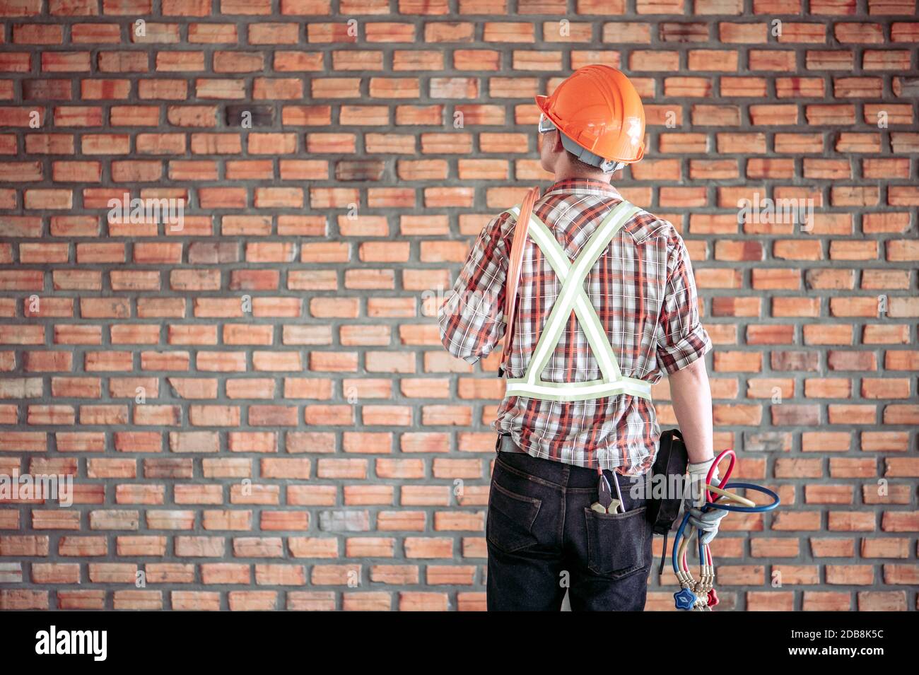 Rear view of an engineer on a construction site, Thailand Stock Photo