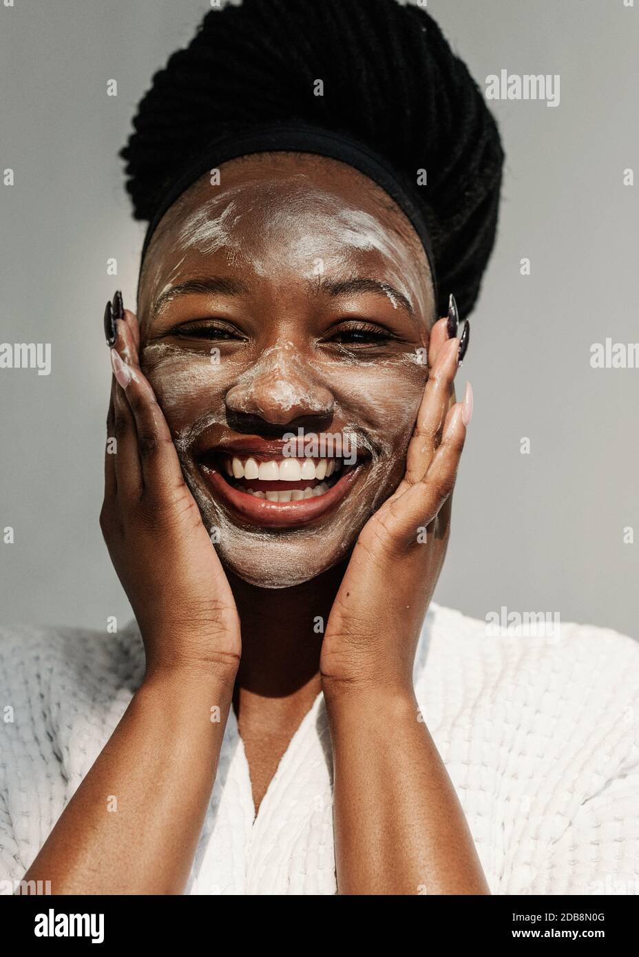 Portrait of a smiling woman with a face mask Stock Photo