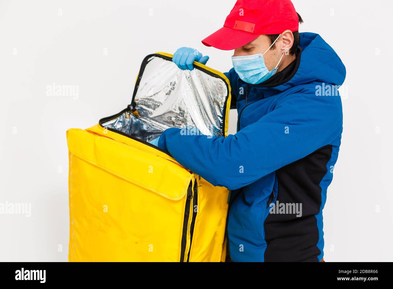 delivery man send food bag for contactless or contact free from