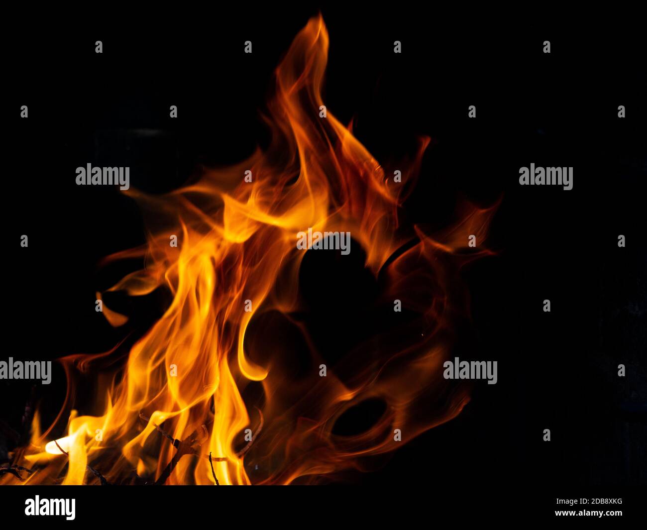 Hot fire with flames and black background Stock Photo - Alamy