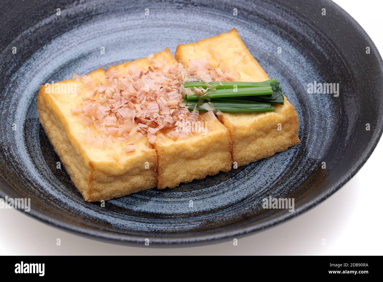 Japanese food, Age tofu cuisine in a dish on white background Stock Photo