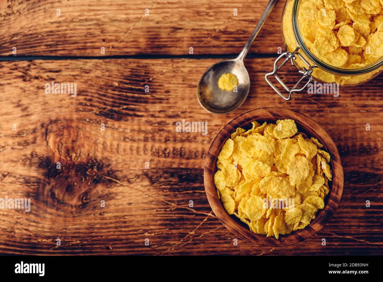 Corn flakes in a wooden bowl for breakfast. View from above Stock Photo