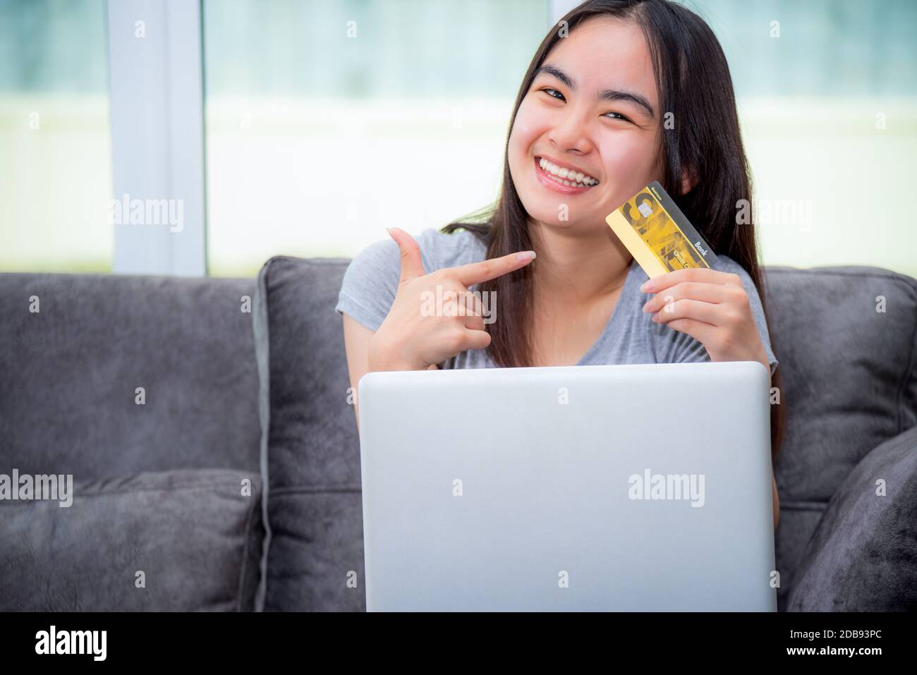 Asian girl credit card laptop hires stock photography and images Alamy
