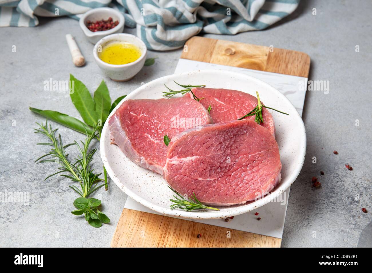 Raw beef steak. Sirloin medallions steaks on white plate Stock Photo