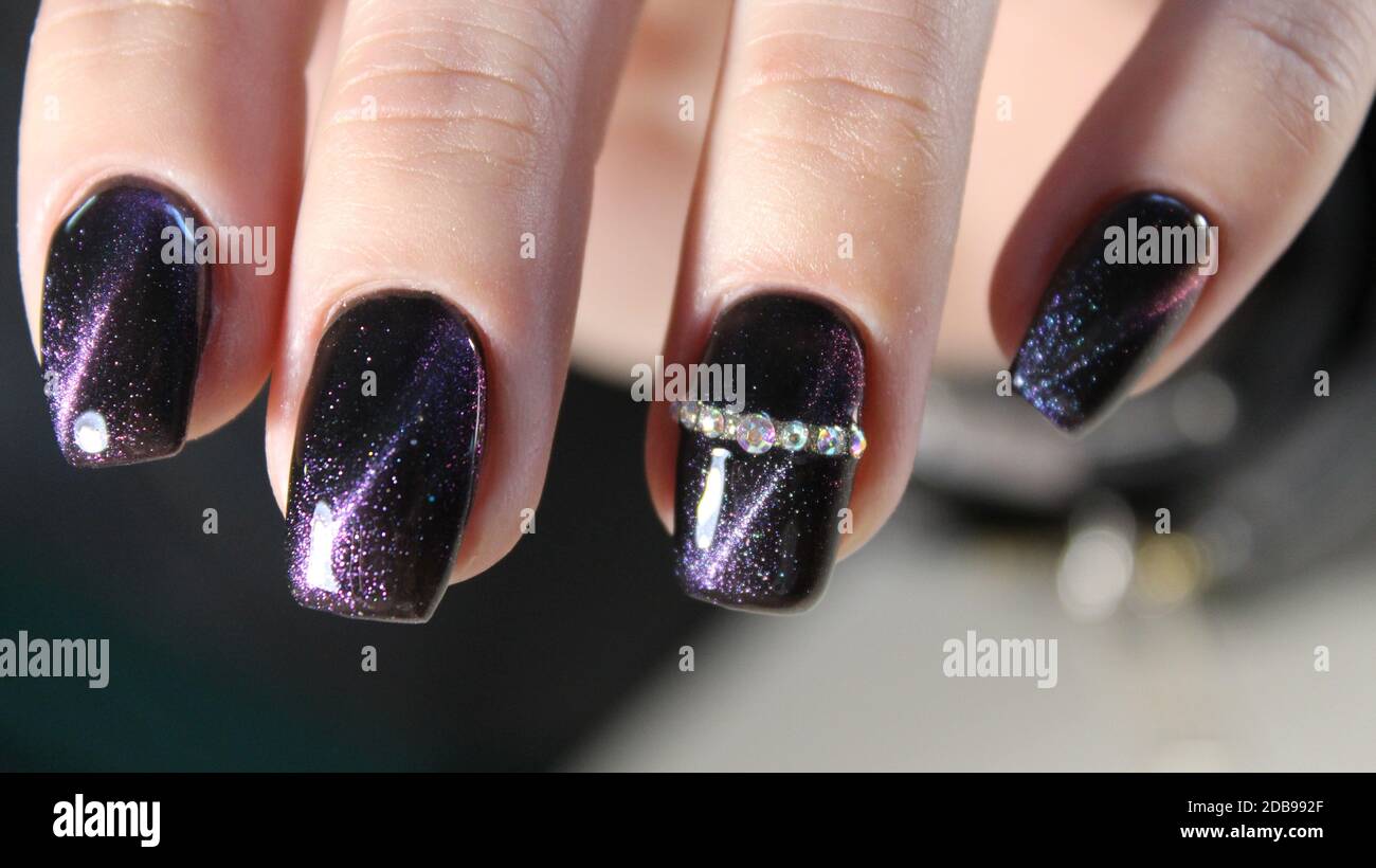 stylish manicure with a design on beautiful hands Stock Photo - Alamy