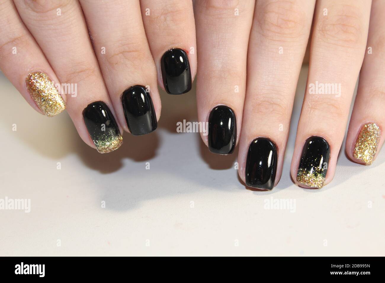 manicure design in black and gold color Stock Photo - Alamy Manicure design in black and gold color Stock Photo - Alamy