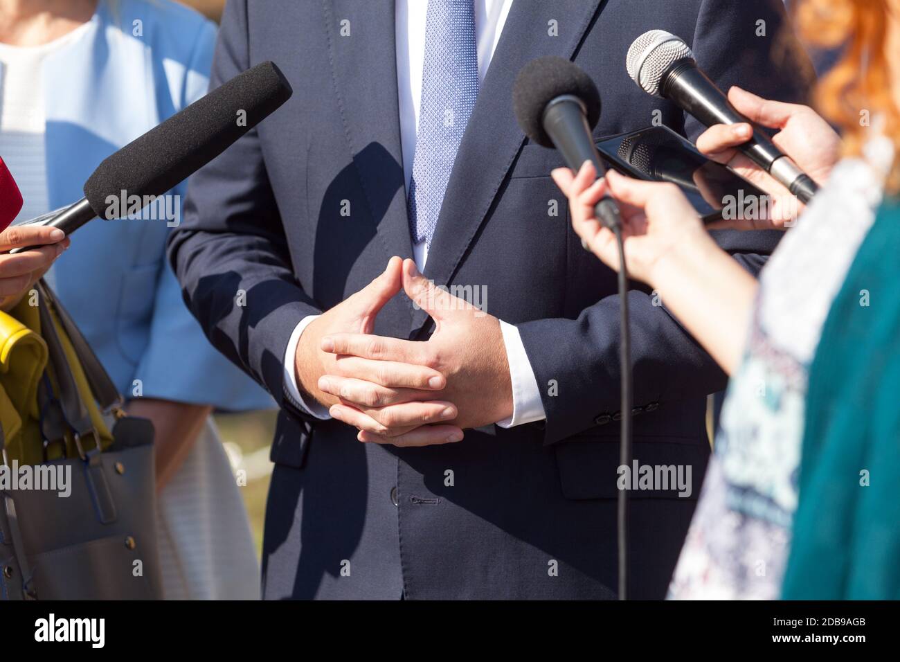 Journalists making media interview with businessman or politician Stock Photo