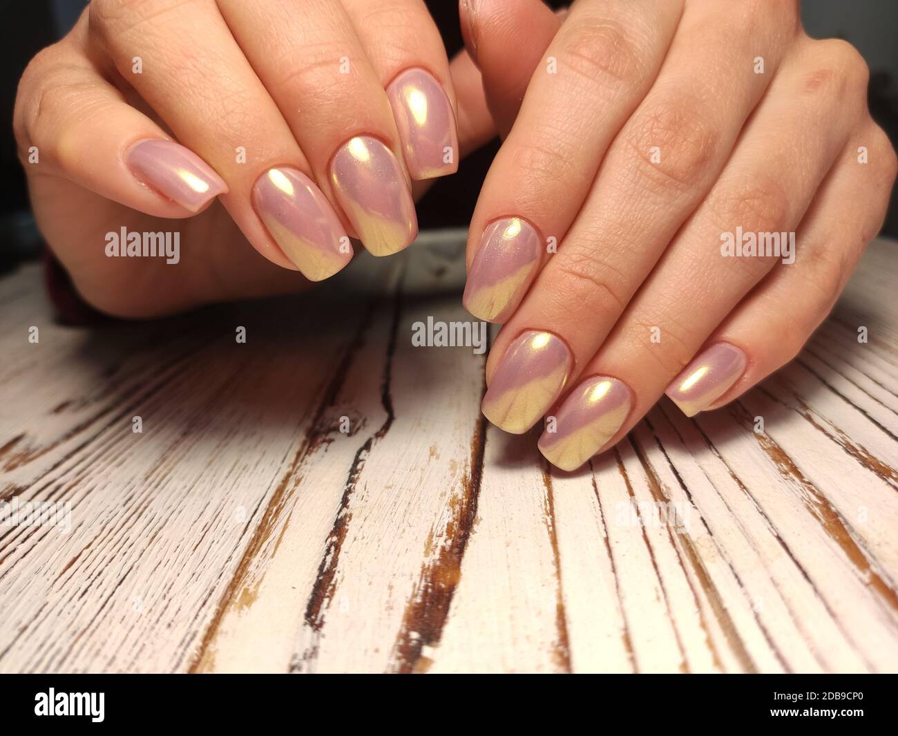 Closeup elegant pastel natural modern design manicure on fabric silk  background. Female hands. Gel