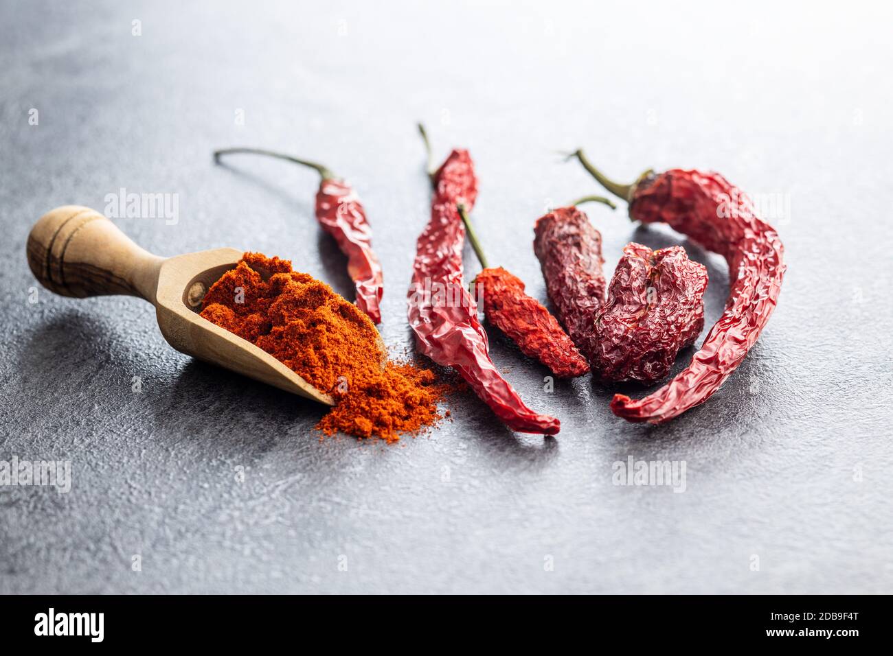 images Dry Red Chilli Powder Png https www alamy com dried red chili peppers and chili powder spice in wooden scoop image385598776 html