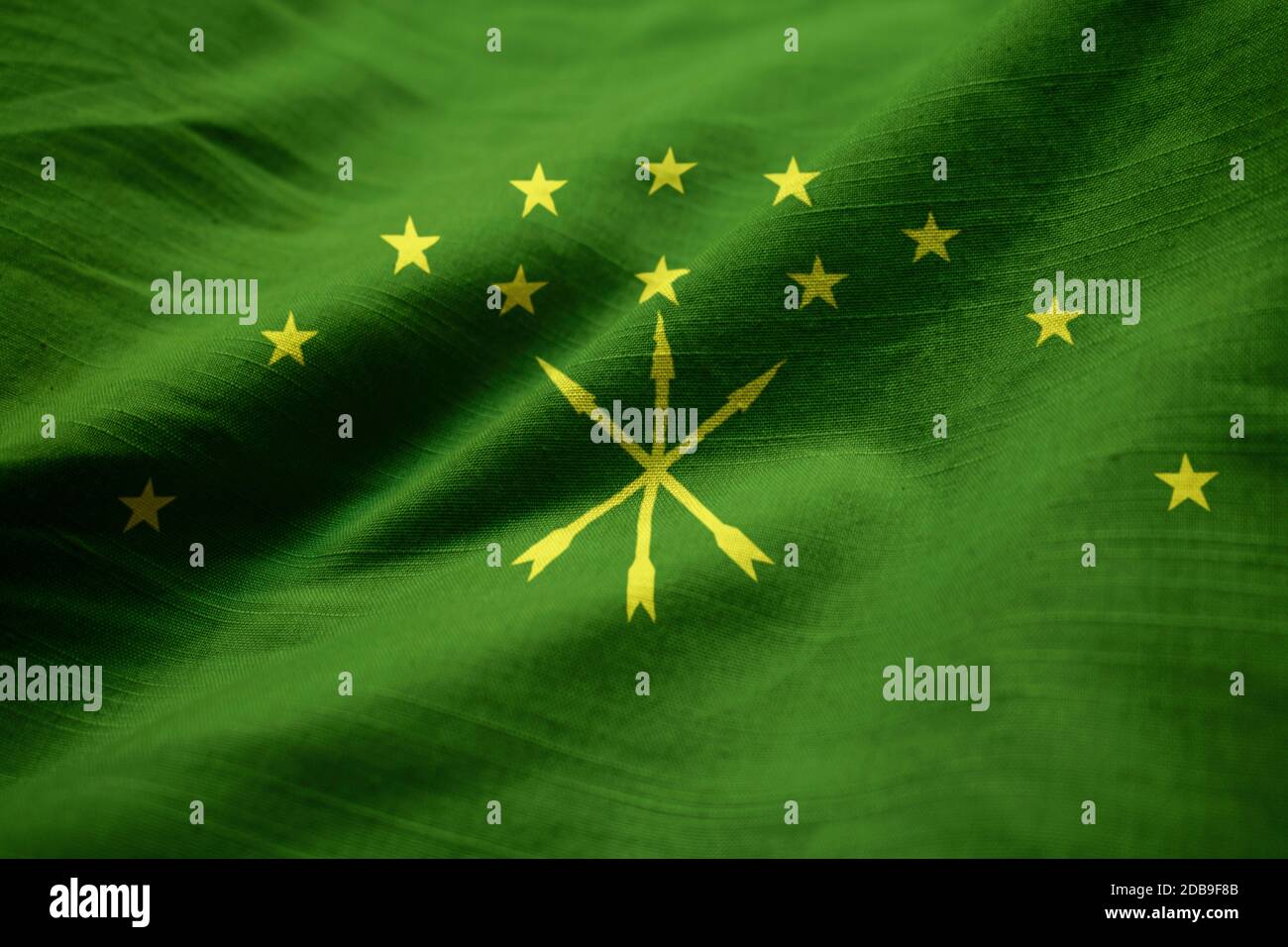 Ruffled Flag of Adygea Blowing in Wind Stock Photo