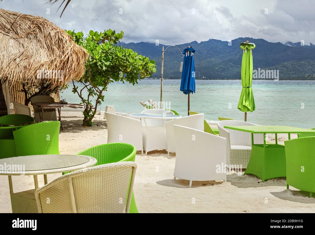 Real deserted cafe on beach at sunny day Stock Photo