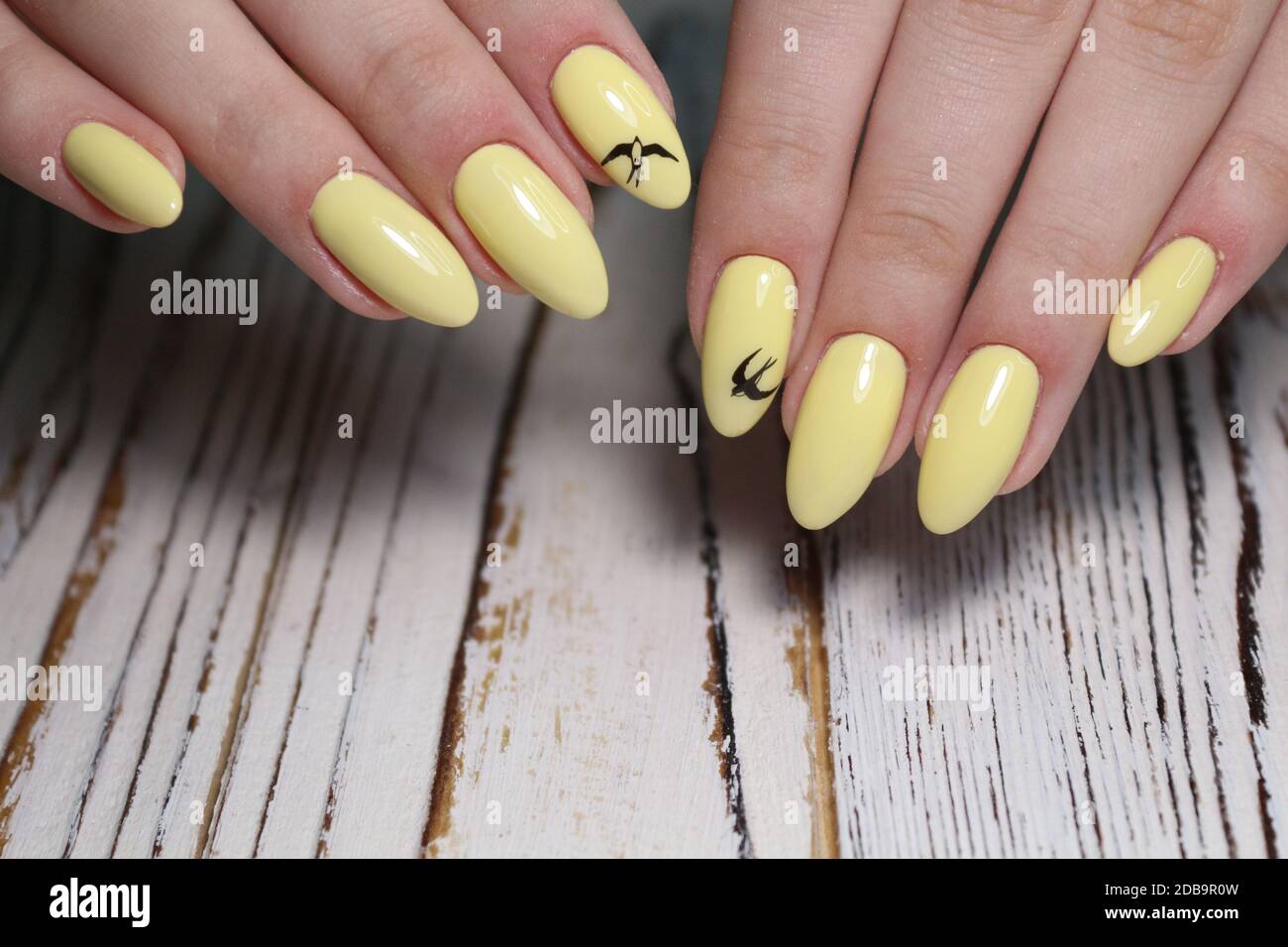 design on yellow manicure beautiful drawing nails 2019 Stock Photo - Alamy