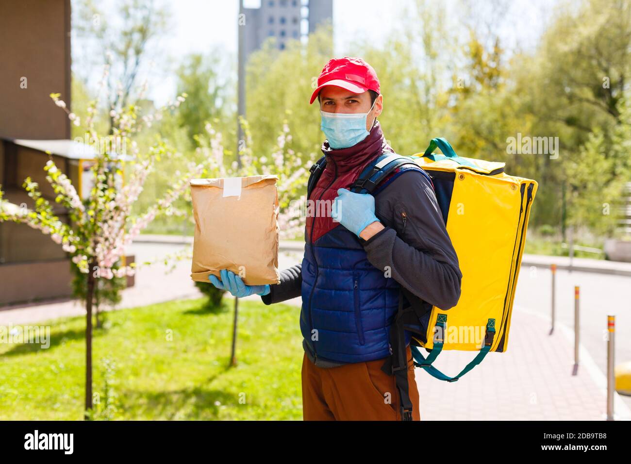 delivery man send food bag at door knob for contactless or contact free