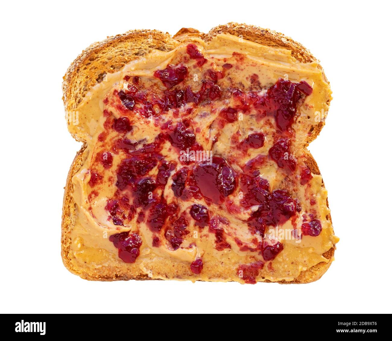 Creamy peanut butter spread with fruit jam on healthy whole wheat toast