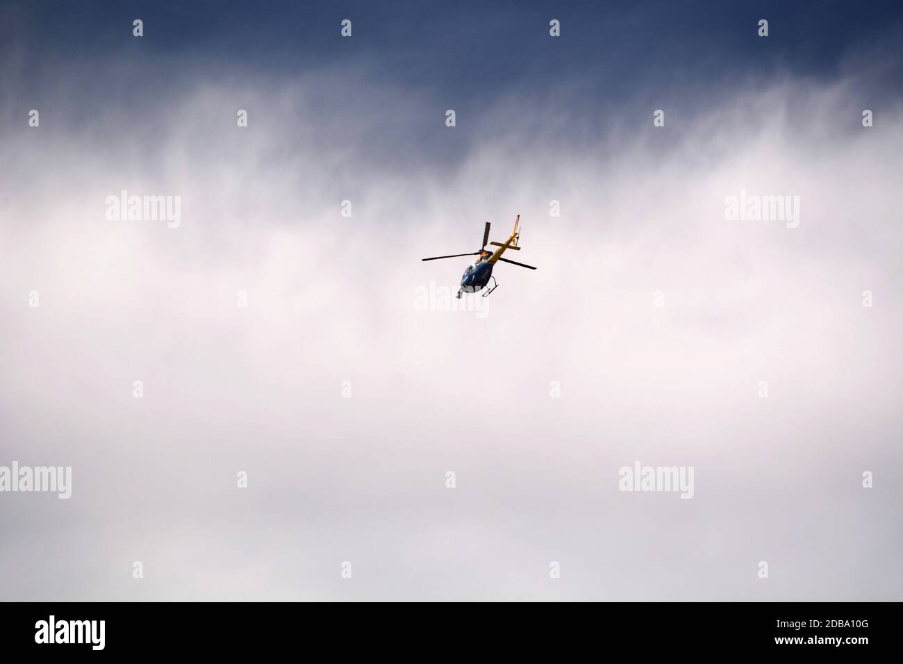 A television news helicopter operated by KRQE in Albuquerque, New Mexico, flies over Santa Fe, New Mexico. KRQE is owned by Nexstar Media Group. Stock Photo