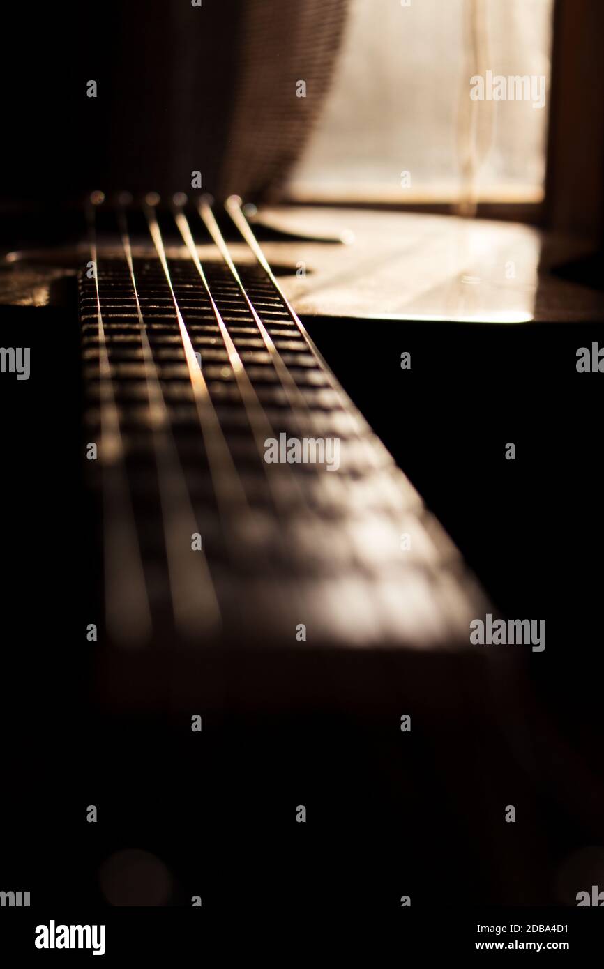 Acoustic Guitar In Music Studio Close up. Shined By The Sun At The