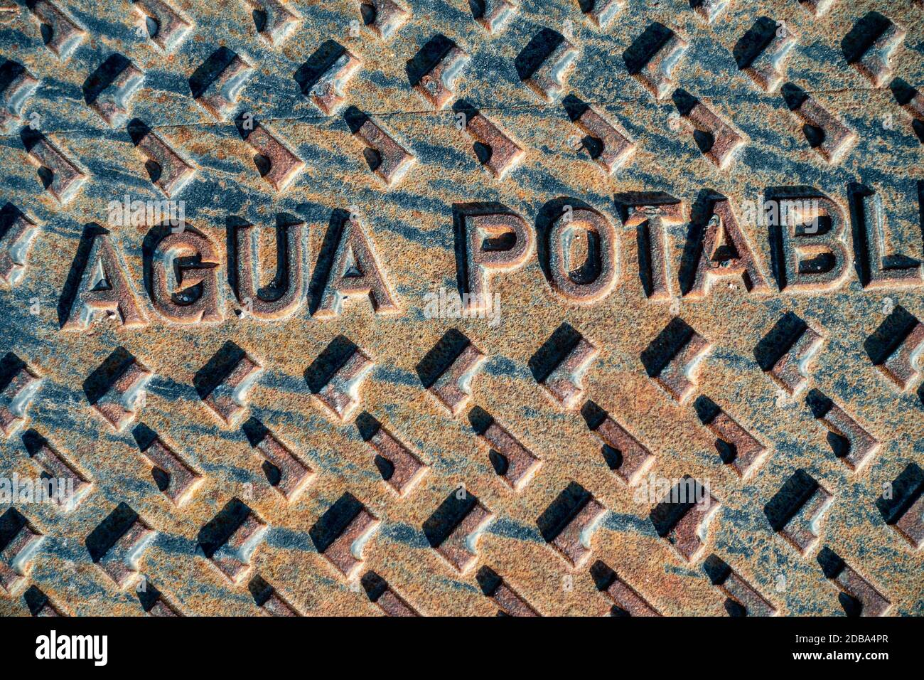 a water manhole cover on spanish urbanisation Stock Photo