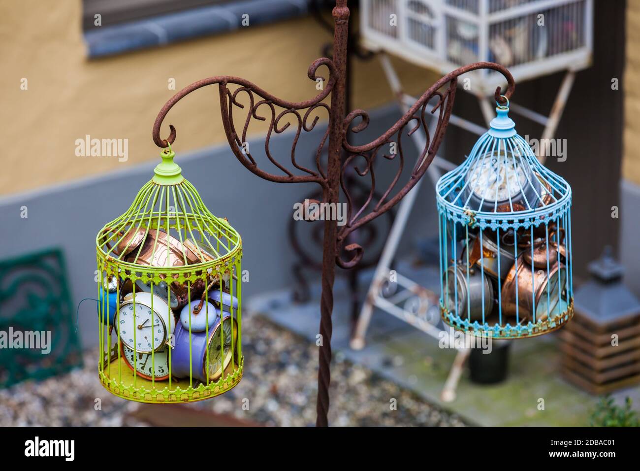 Antique alarm clocks in a bird cage Stock Photo - Alamy
