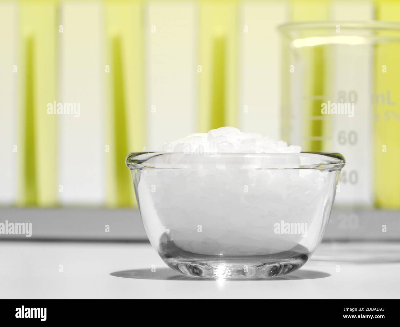 Close up White flake chemical on laboratory table. Cetyl esters wax