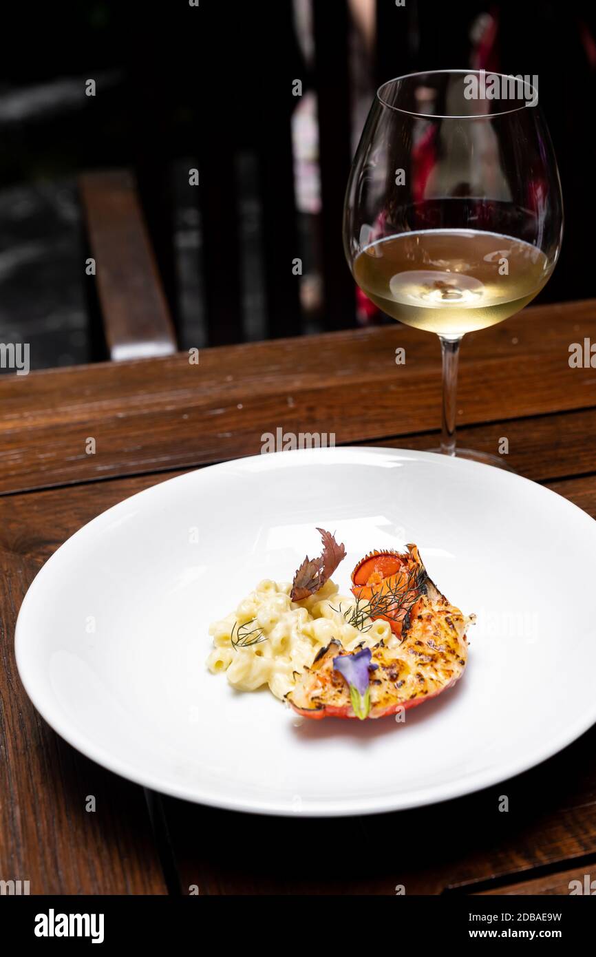 Close Up Of Grilled Boston Lobster Tail With Fried Cheese Macaroni International Gourmet Cuisine With Glass Of White Wine In Live Station A La Carte Stock Photo Alamy