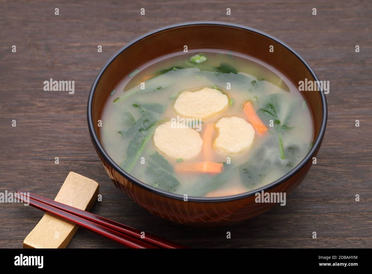 Japanese food, Miso soup of fu and vegetables in a bowl on table Stock Photo