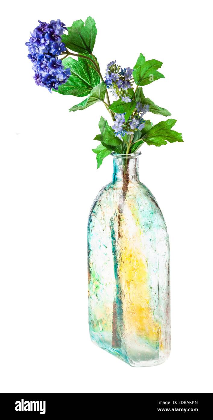 artificial hydrangea flowers in hand painted glass flask isolated on white background Stock Photo