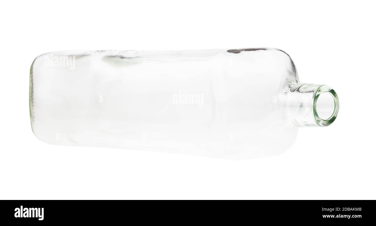 lying empty clear whiskey bottle isolated on white background Stock Photo