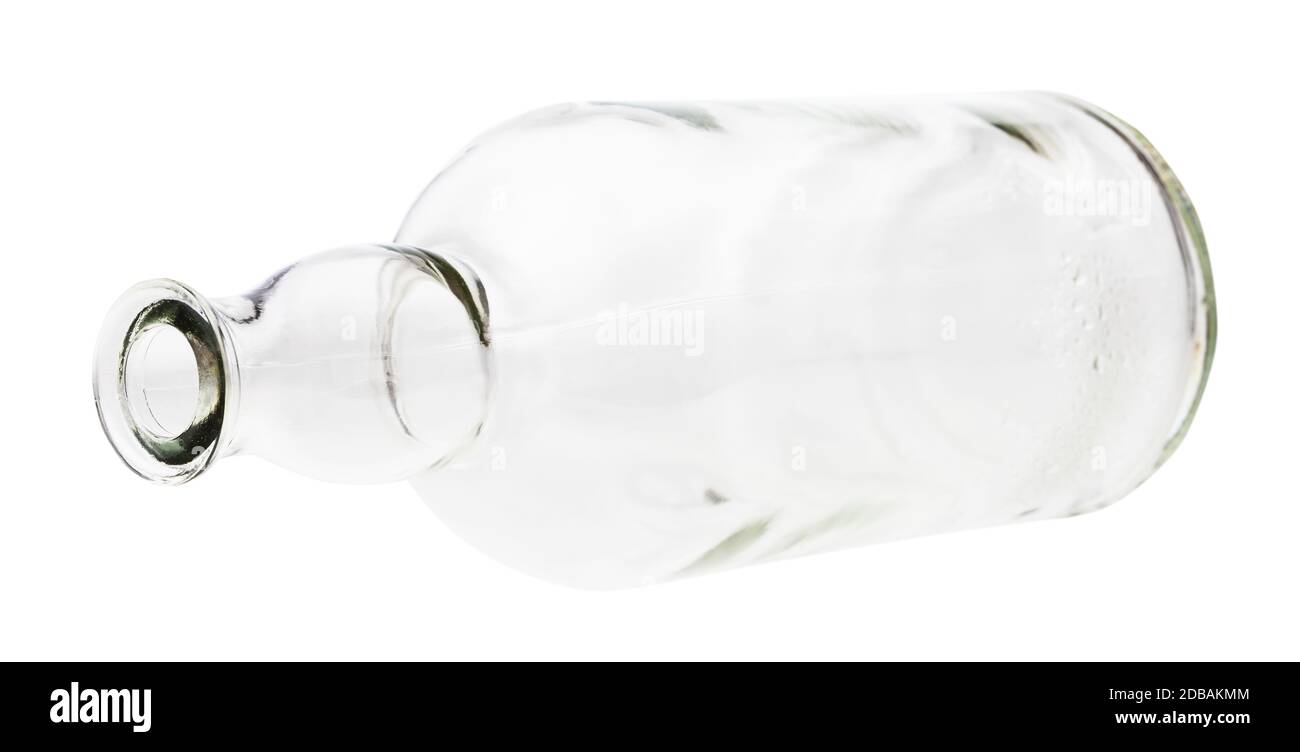 lying empty clear brandy bottle isolated on white background Stock Photo