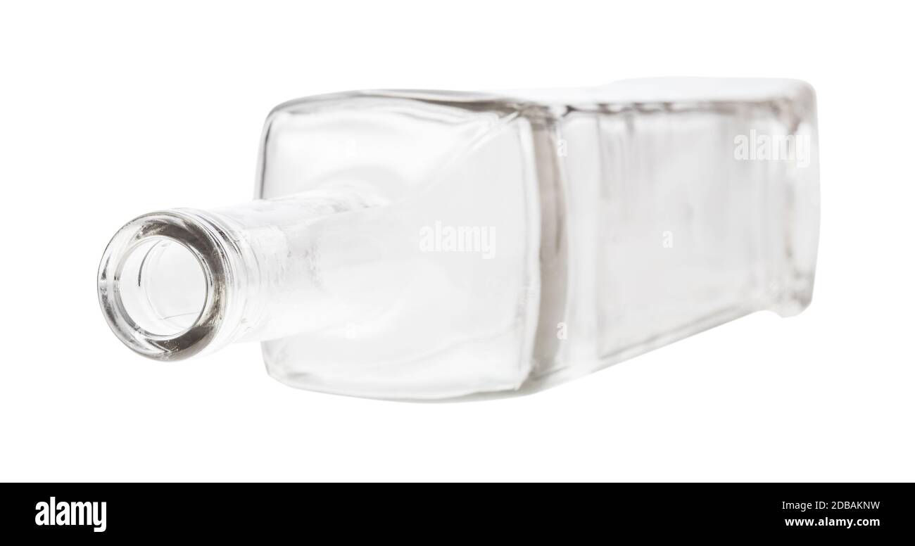 overturned empty clear wine bottle isolated on white background Stock Photo