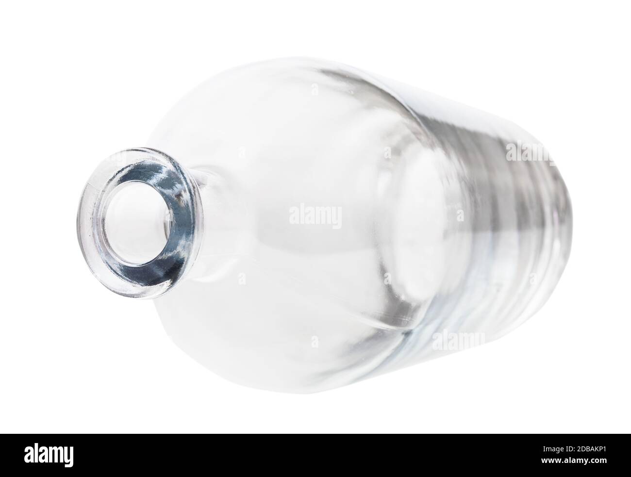 overturned empty clear liquor bottle isolated on white background Stock Photo
