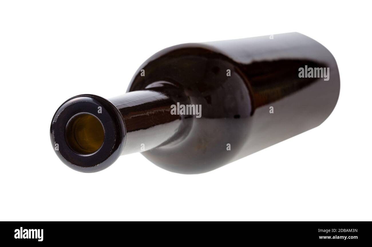 overturned empty dark brown wine bottle isolated on white background Stock Photo