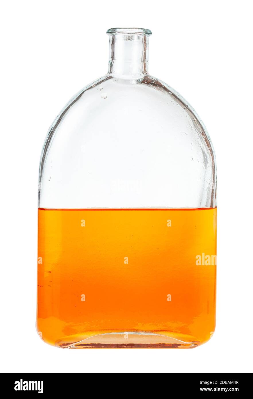 solution of orange watercolour in water in glass flask isolated on