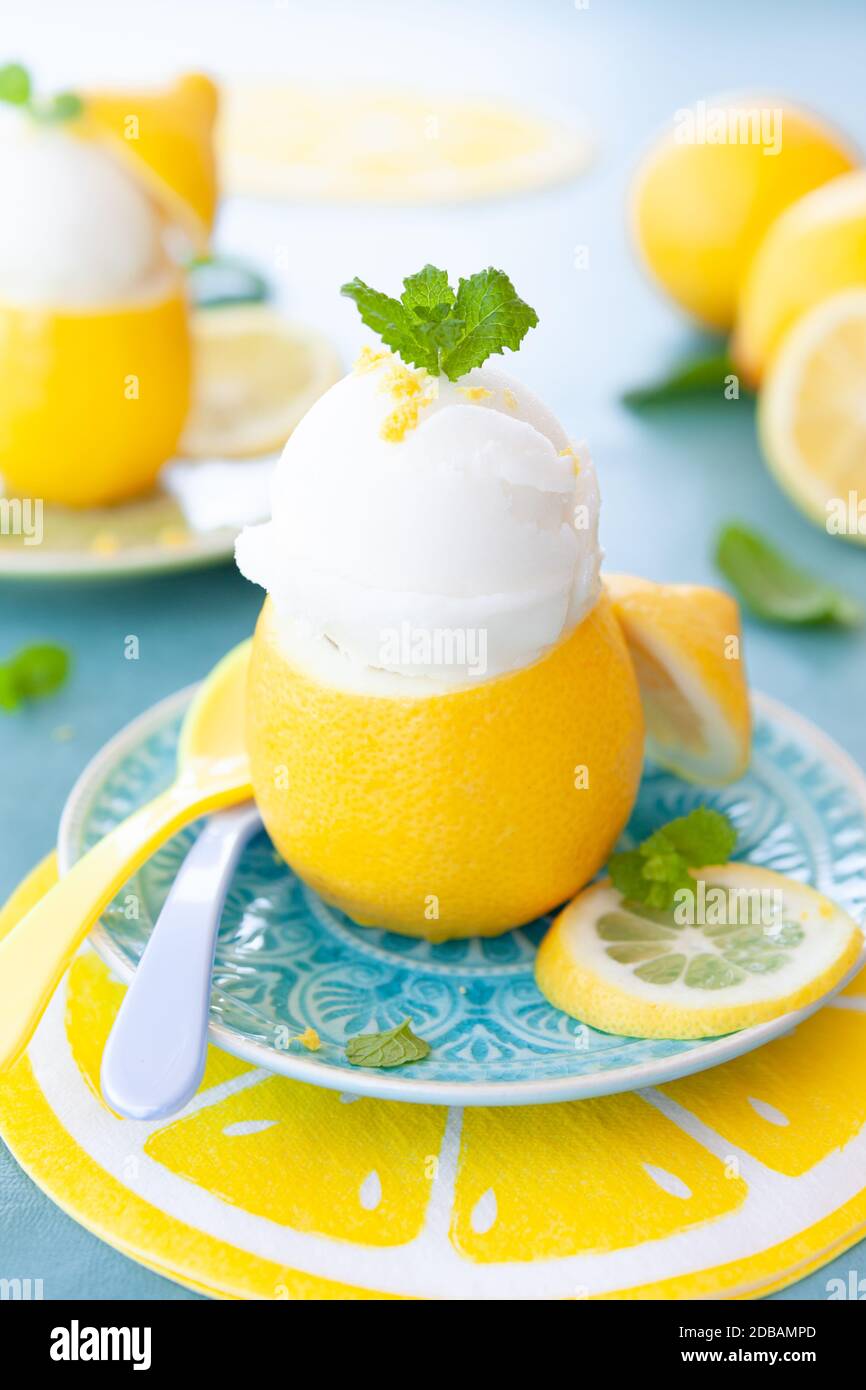 Ice cold lemon sorbet with fresh mint leaves Stock Photo