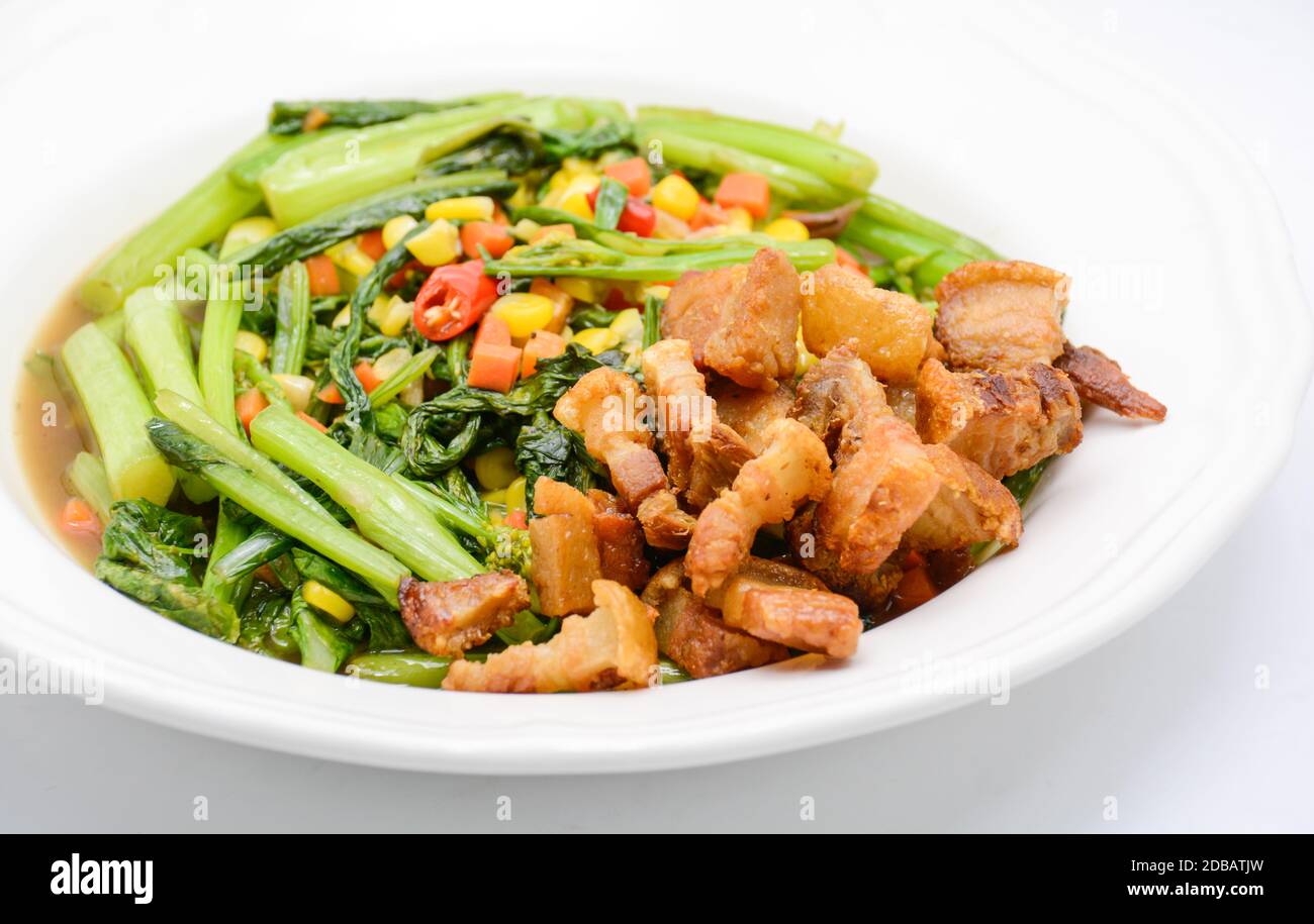 Stir fried Chinese kale with oyster sauce and pork Stock Photo Alamy