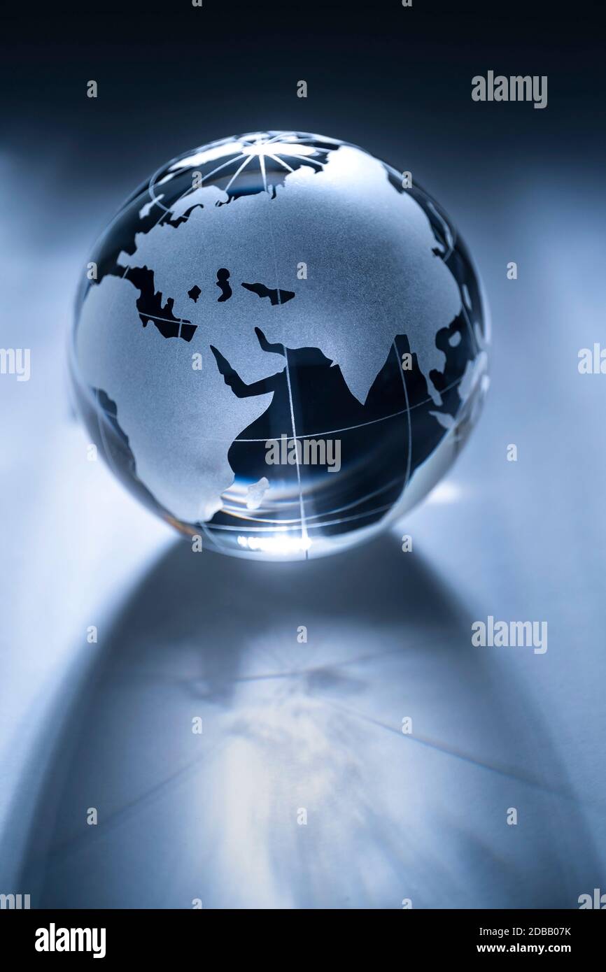 Glass globe on gray background Stock Photo