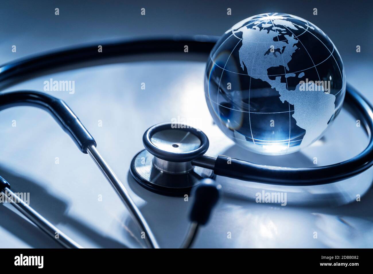 Glass globe and stethoscope on gray background Stock Photo Alamy