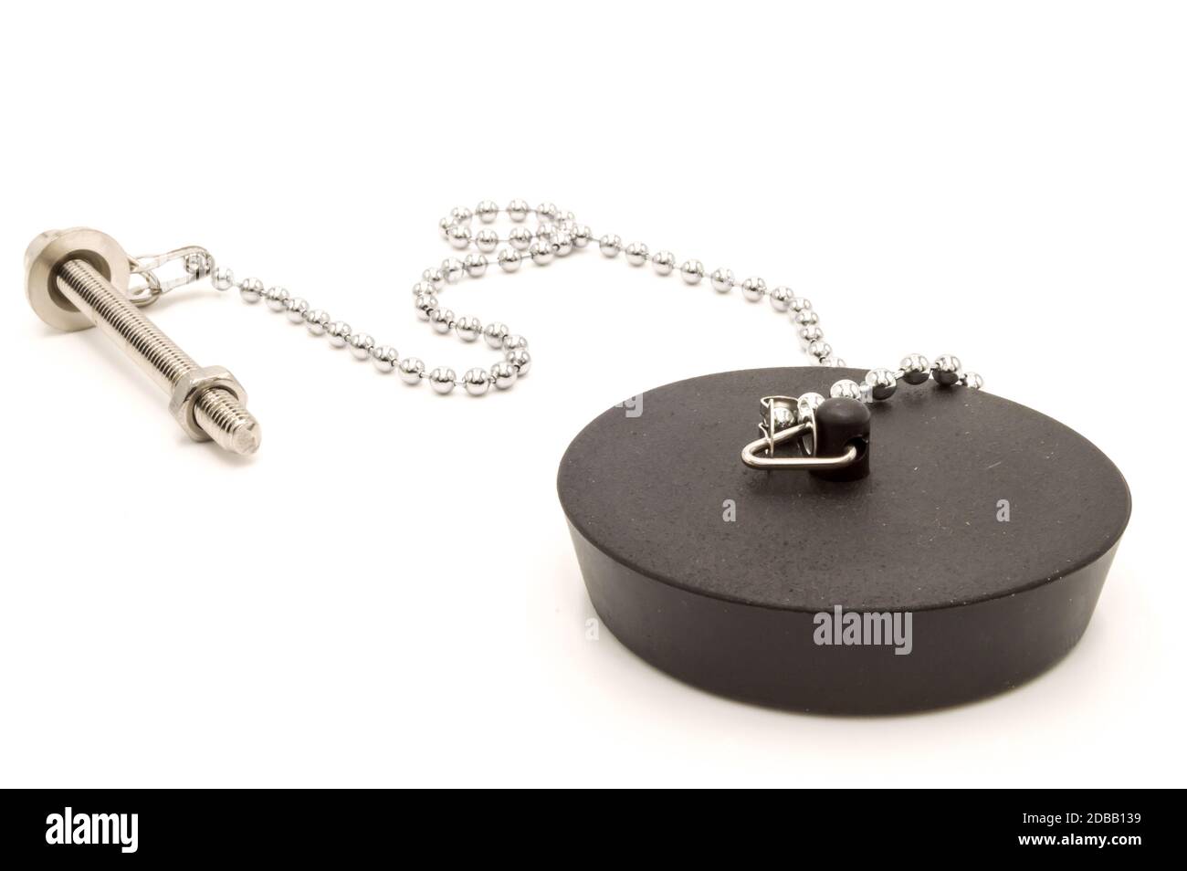 Black rubber sink stopper with chain and chrome screw on white
