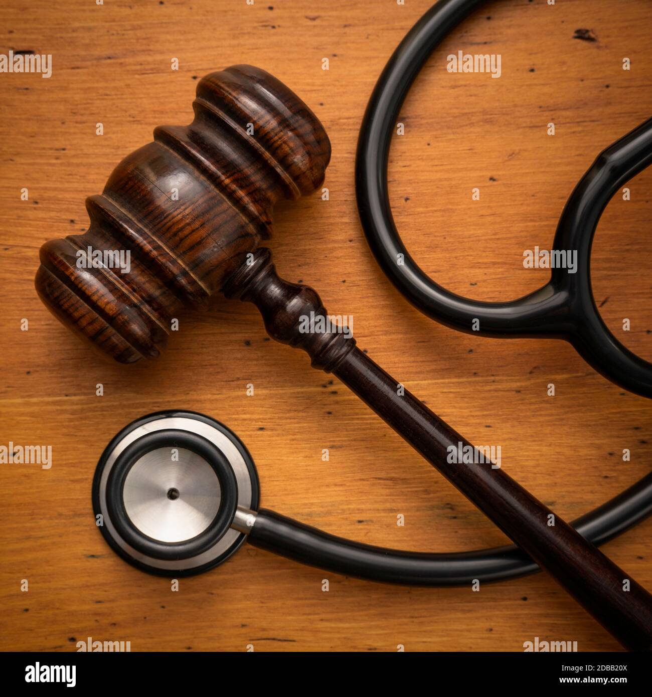 Gavel and stethoscope on wooden background Stock Photo