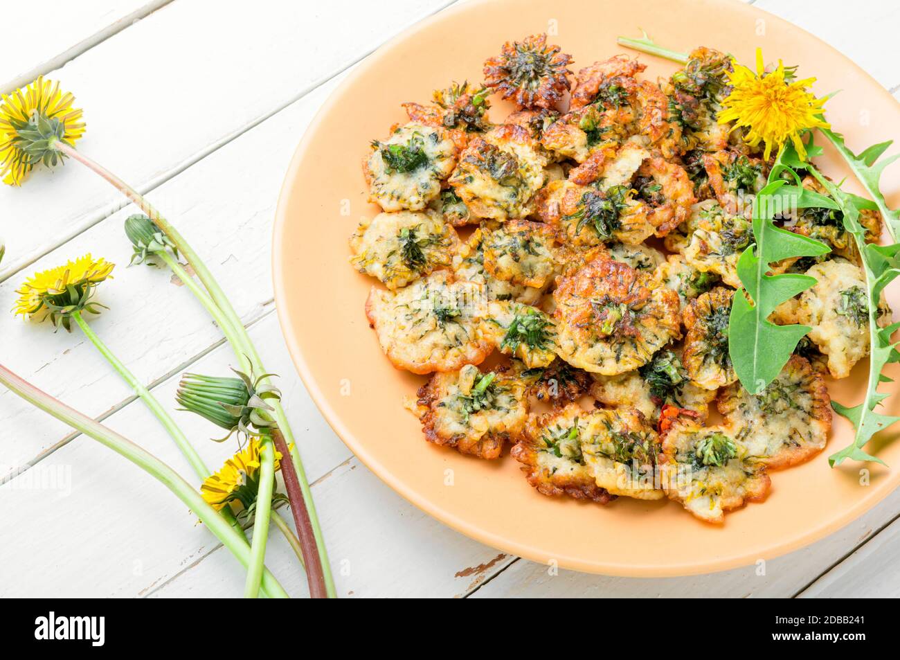 An unusual dish of fried dandelion flowers Stock Photo - Alamy