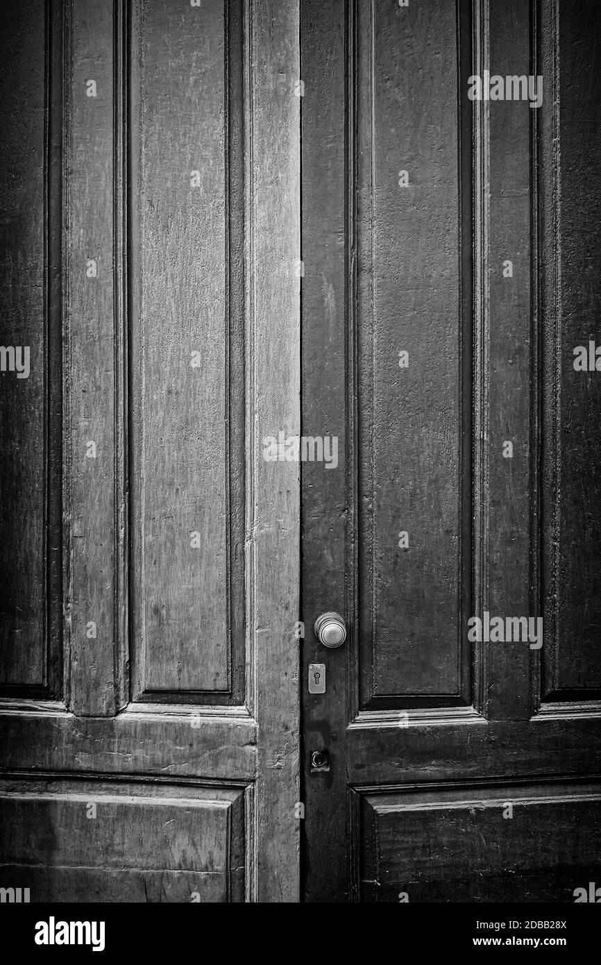 Door wood old and dirty, detail of an old door painted with two colors