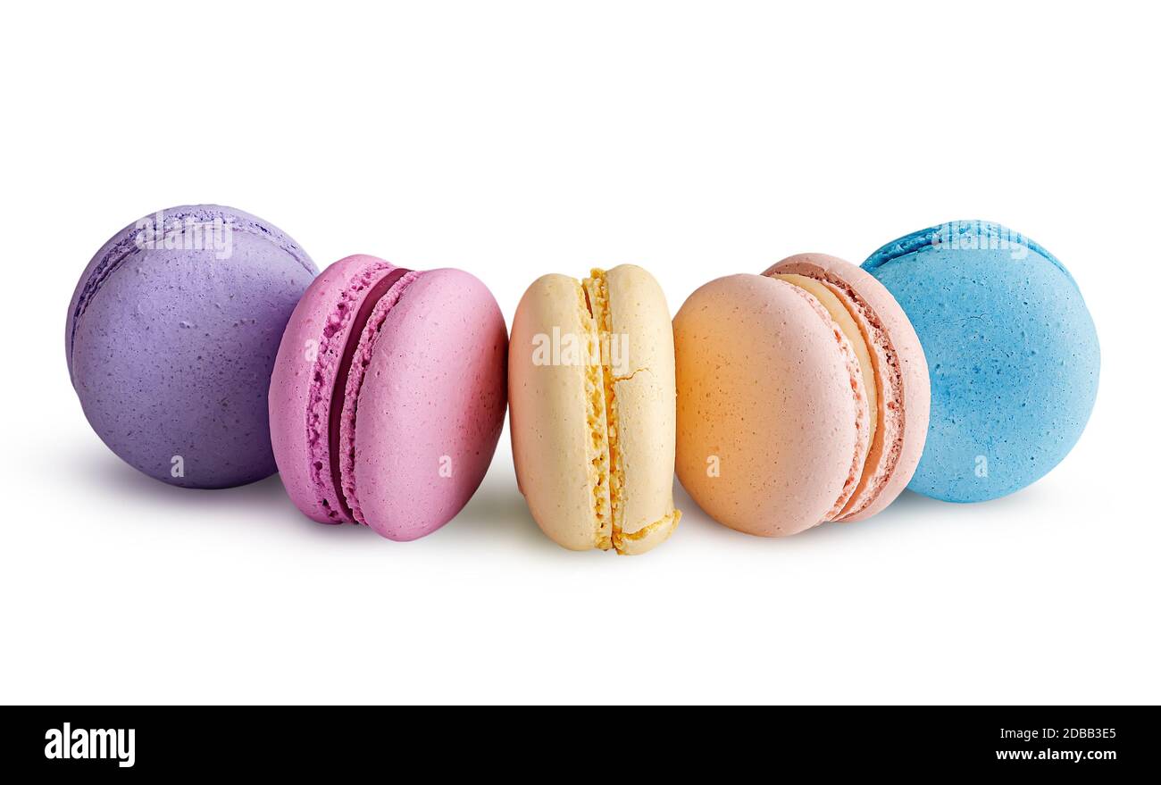 Five multicolored macaroon in semicircle on white background Stock Photo