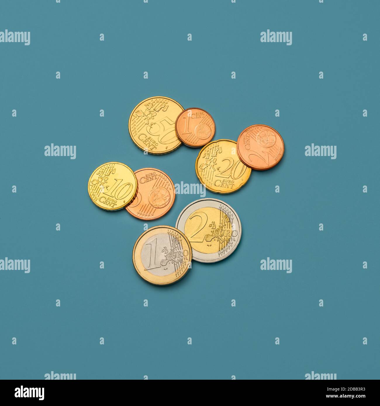 Euro coins on blue background Stock Photo