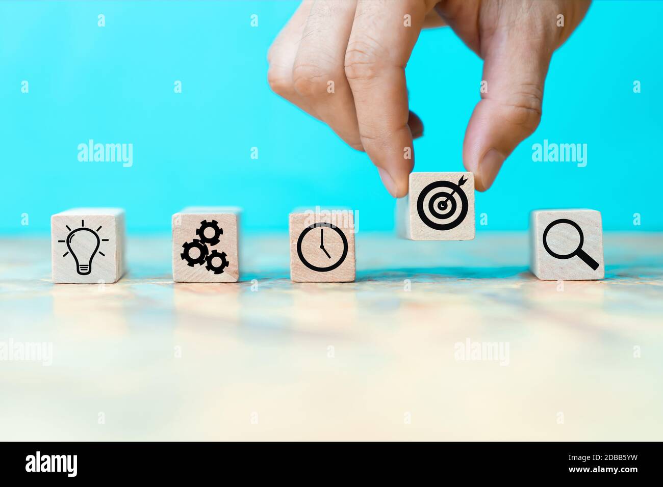 Businessman hand arranging wood block with icon business strategy Stock ...