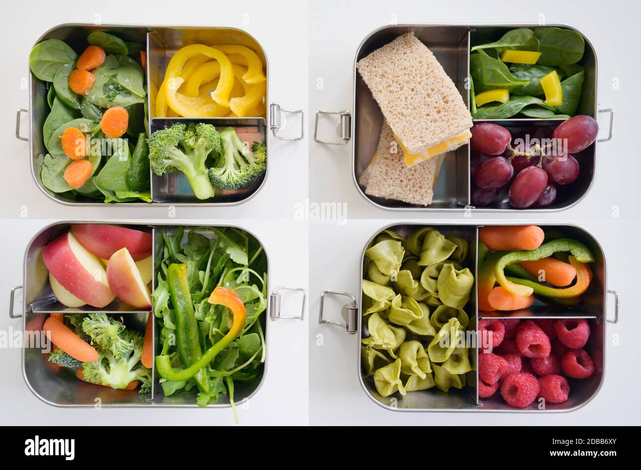 Lunch boxes with fresh vegetables and fruits Stock Photo