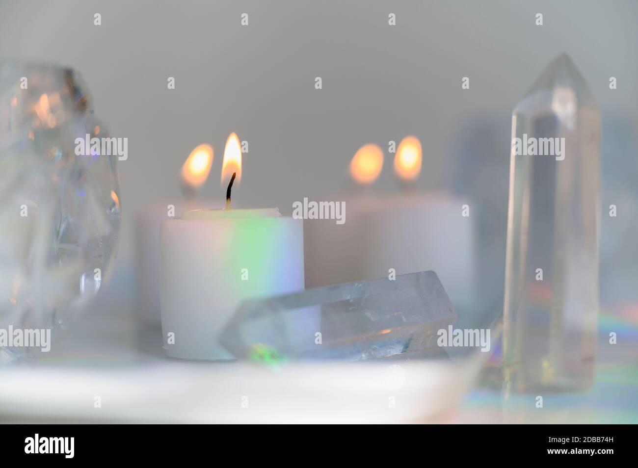 Composition of burning candles and crystals Stock Photo Alamy
