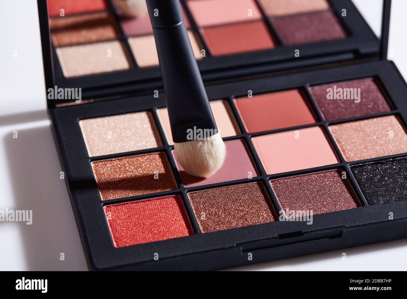Close-up of palette of eyeshadows and brush Stock Photo