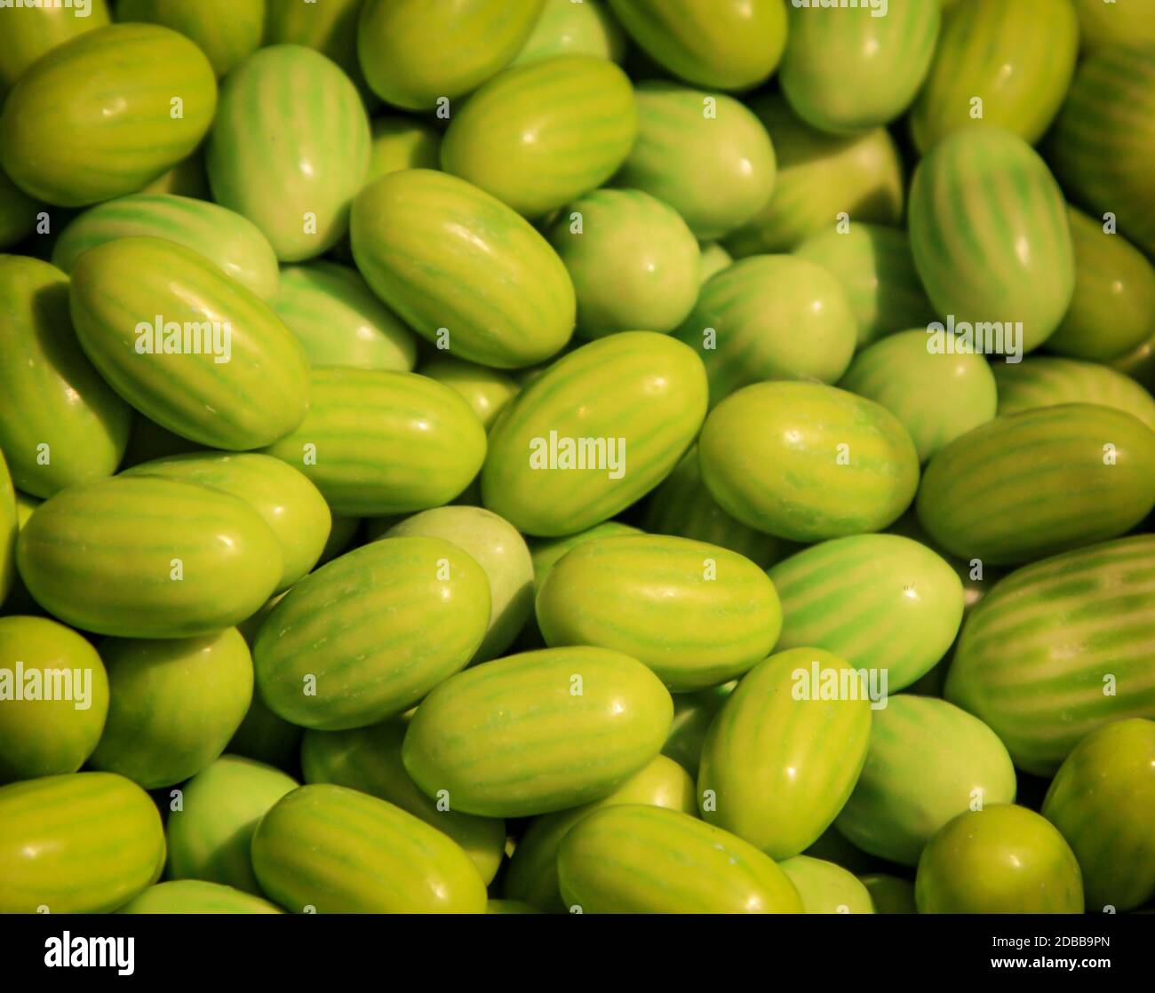 Many chewy candies that are shaped and colored like melons Stock Photo